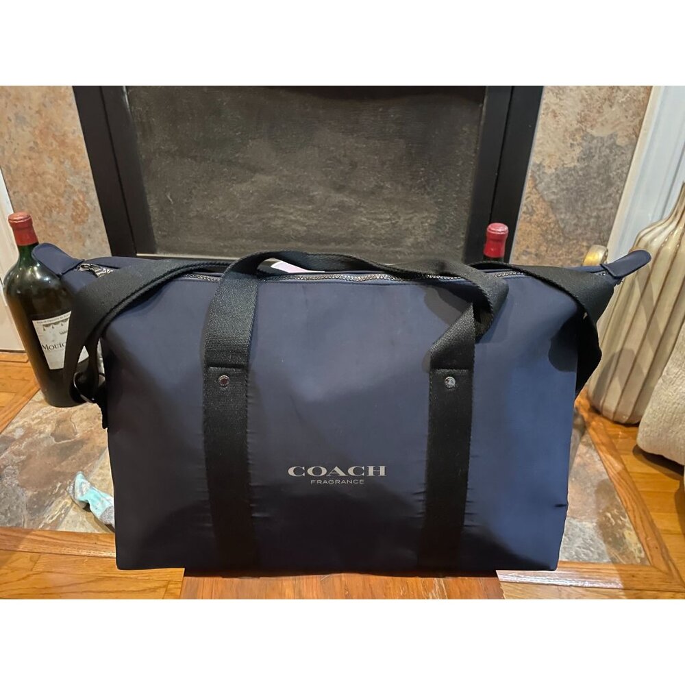 B203 - Coach Fragrance duffel weekender bag made of polyester with black handles